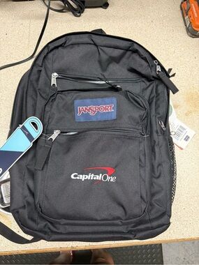 Jansport Black Backpack with Red Accent and Navy Patch